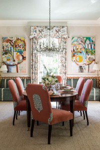 The dining room, designed by Margaret Kirkland Interiors, balances elegance and comfort with custom fabric treatments and playful colors.          