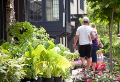 A couple browses the floral selection outside Mt Laurel Grocery & Deli.  