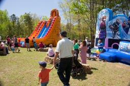Children relish the opportunity to play in bounce houses and on slides at the Mt Laurel Spring Festival.  