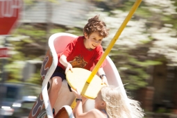 Children take a whirl on an amusement ride during the Mt Laurel Spring Festival.  