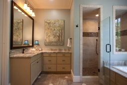 This luxurious bathroom includes a spacious shower, ornate tub, and marble countertops.                      