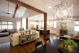 Wooden beams lend a traditional, yet rustic look to this home's open-concept living room.                         