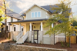 The Leatherwood Cottage featuring a wraparound front porch, part of the new Homes at Olmsted Park collection.      