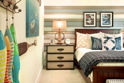 A fisherman's bedroom with unique wood wall accents.                        