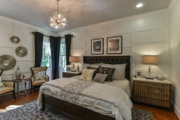 Unique wood trim adds character to the contemporary design in this master bedroom.                        